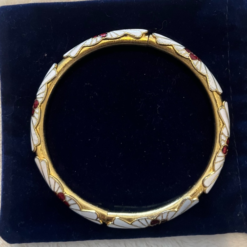 Vintage cloissone bracelet with flowers on white and gold tone background